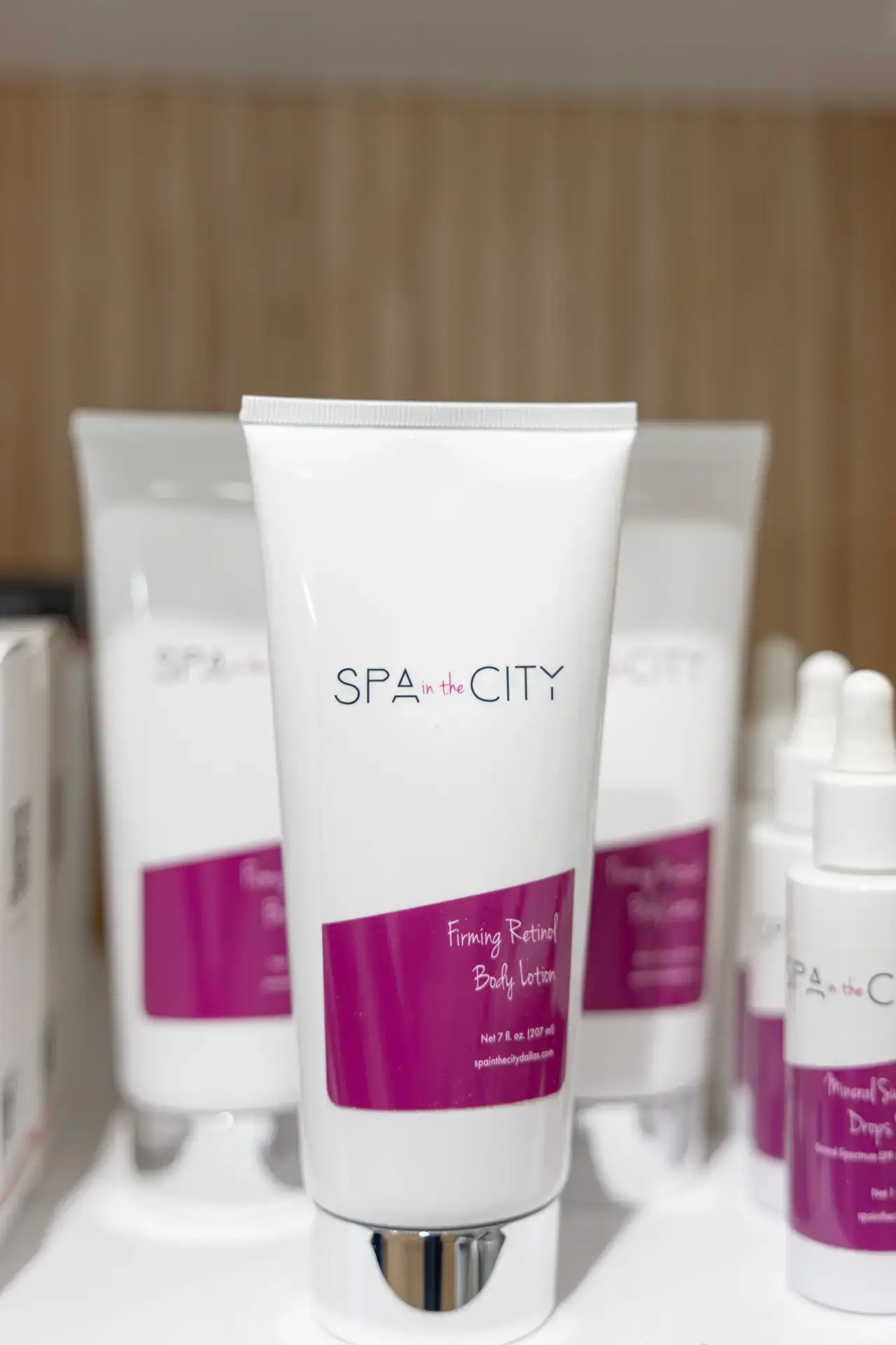 Spa in the City skincare bottles on a retail shelf, from the practice's years before the Well Labs+ name