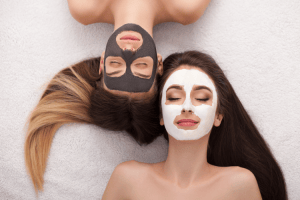 Flat lay of skincare products like serums and masks used during a facial, emphasizing personalized skin treatments.